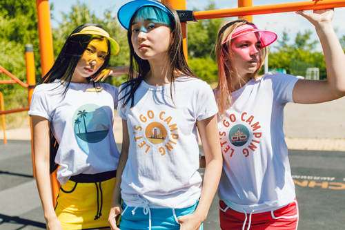 3 girls in T-shirts Striking Poses Outside