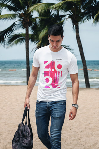 Man Walking Along the Beach
