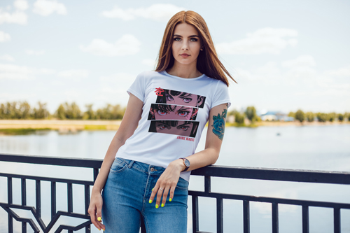 Woman in T-shirt Leaning Against Bridge