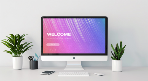 iMac and Supplies on a White Backdrop