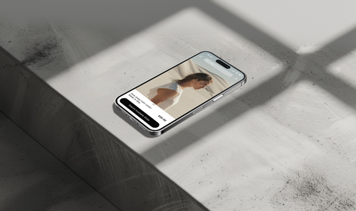 App on iPhone 15 Pro Screen on a Stone Desk