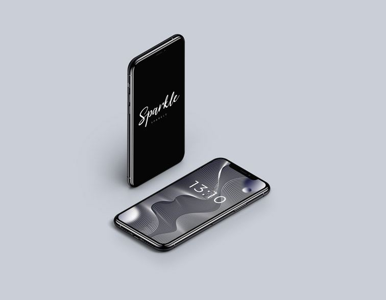 2つのiPhoneがあり、1つはスタンドに立てかけて、もう1つは隣に寝かせて置いてあります