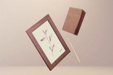 Frame with a Sketchbook and a Pencil
