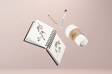 Notepad with a Paper Cup and Pens