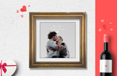 Frame Next to a Wine Bottle and a Heart Box