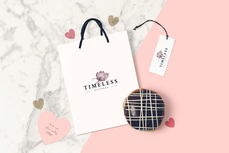 Bolsa de regalo, bizcochito y fondo de mármol