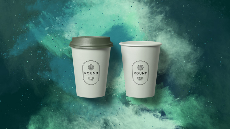 Two Paper Cups on a Green Smoky Background