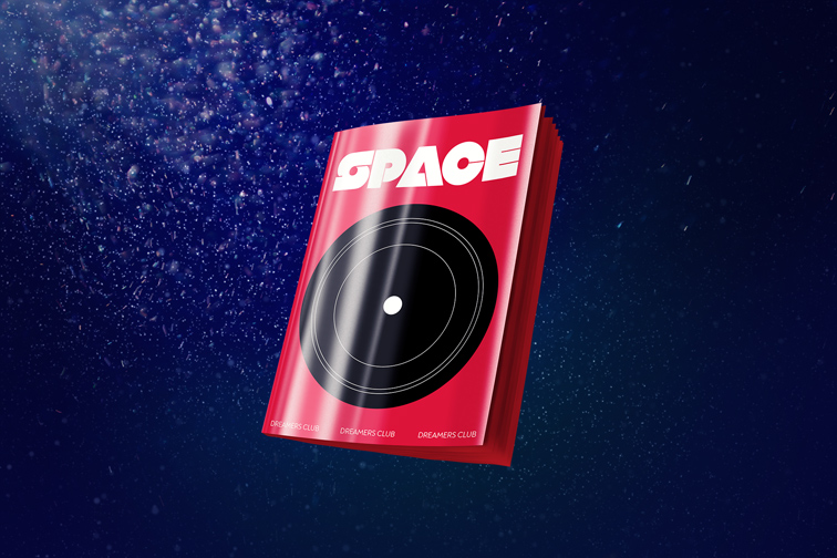 Libro de tapa blanda sobre un fondo de partículas