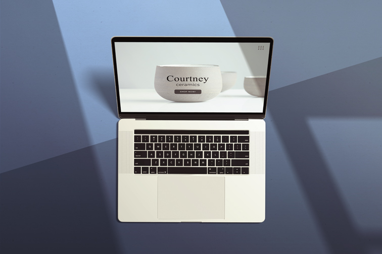 MacBook on a Blue Shaded Background