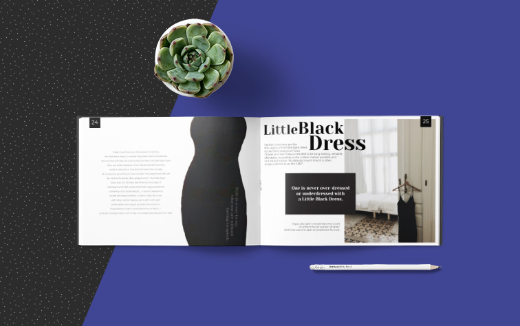 Magazine en format paysage ouvert, crayon et un cactus